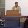 Akbar Abdul Rasul speaking from a lectern