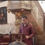 Akbar Abdul Rasul reading at a lectern